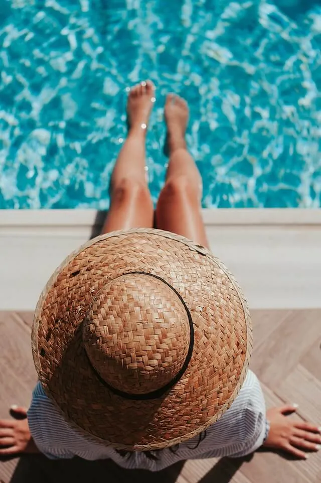 A tourist relaxing by the pool